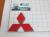 Эмблема шильдик логотип Mitsubishi красный на багажник, решетку 103x92 мм