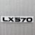 Шильдик LX 570 Lexus на крышку багажника 185x26 мм с клеевой основой.