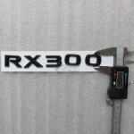Шильдик RX 300 Lexus на крышку багажника 118x21 мм с клеевой основой.